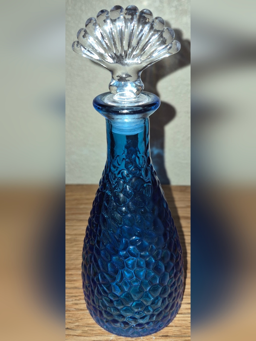 Gorgous Ocean-themed Blue Pebbled glass bottle with a clear seashell stopper